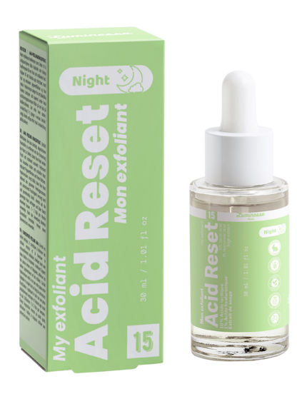 Packshot d’Acid Reset n°15 de Luminesse Paris avec son étui vert clair et son flacon compte-gouttes transparent de 30 ml. La boîte et le flacon sont présentés côte à côte sur fond transparent ; le packaging indique un exfoliant de nuit avec 10 % d’acide lactique, 1 % d’acide hyaluronique et extrait de sauge.