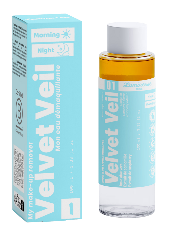 Packshot de Velvet Veil n°01 de Luminesse Paris avec son étui turquoise et son flacon biphasé de 100 ml. La boîte et le flacon sont présentés côte à côte sur fond transparent ; la phase ambrée est visible dans le flacon, avec les mentions Morning, Night, aloe vera, camomille et framboise sur le packaging.